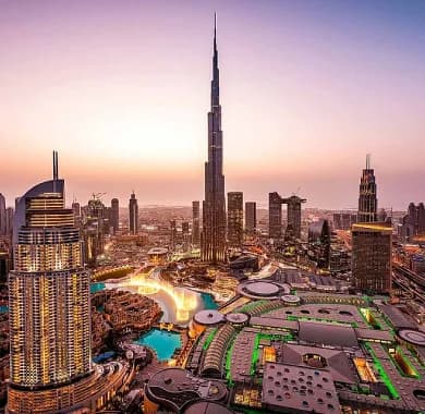 Sunset view of Dubai Downtown featuring Burj Khalifa